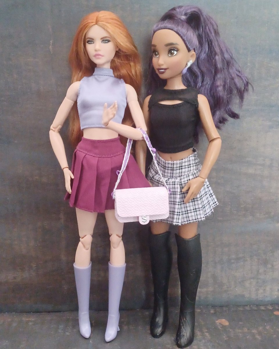 Amber and Nyx decided to wear matching outfits today! Pleated skirts can honestly make any doll's outfit look amazing! I also headcannon them being roommates!💜🖤 #barbie #barbiedoll #barbiedolls #disneyilydoll #disneyilydolls #mattel #dolls #dollphotography #restyle #dollrestyle