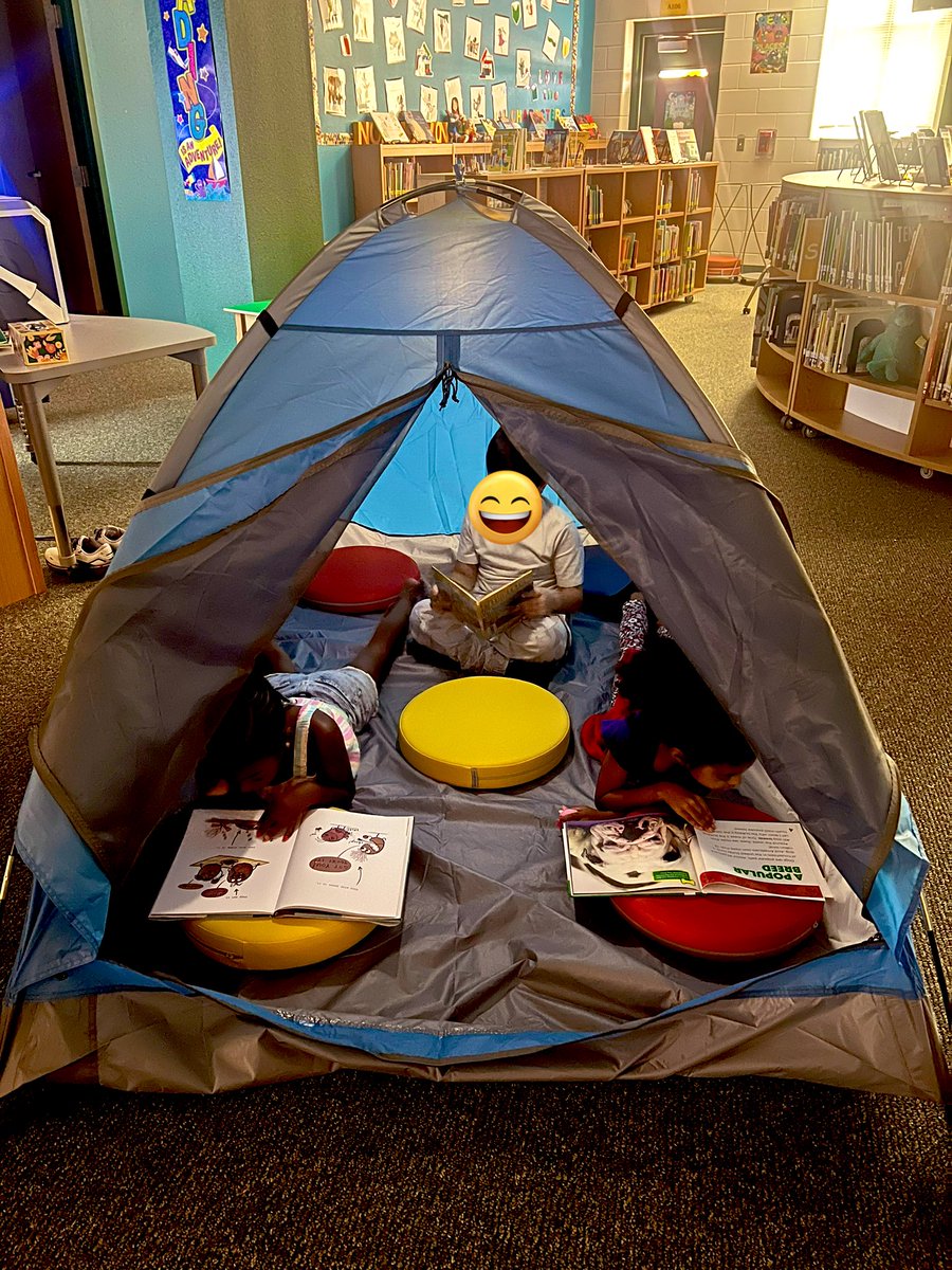 NISDLib's tweet image. It’s Camp Read S’More at the @NISDWernli library today! Students got to enjoy some books by the “campfire,” in tents, and with flashlights. They also learned how they can keep reading all summer long! #NISDLibraries #TeamNorthside @nisd @WernliLibrary