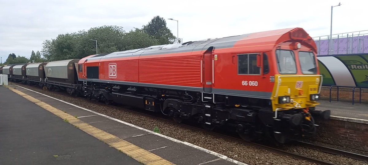 An immaculate DB cargo class 66 66060 on todays tunsted to Lostock works loaded hoppers seen at altrincham bang on time.