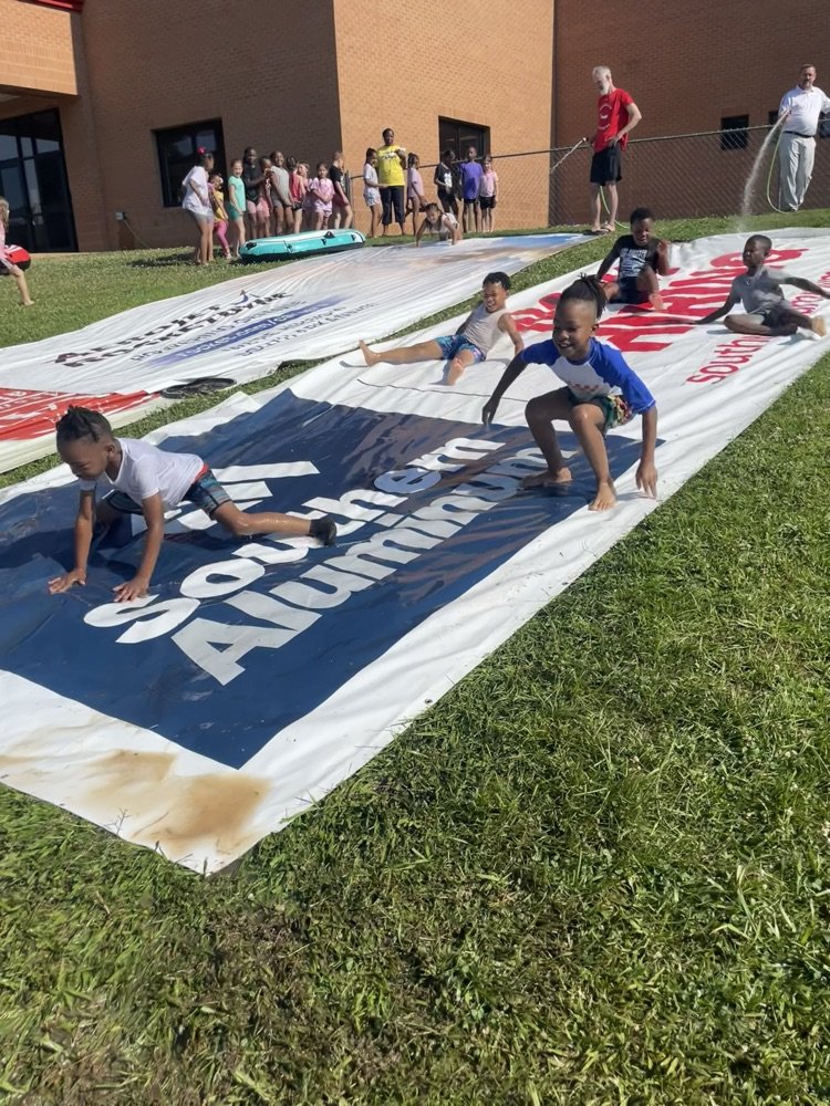 Thank you to Jason Ray and Southern Aluminum for providing our slip n slides today! These work much better than anything we have tried! Businesses: don't throw your old billboard banners away! Donate them to a school to use for days like this!