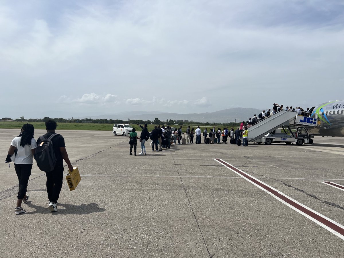 The AP is aboard the first commercial flight out of Port-au-Prince since the airport closed nearly three months ago. We are sitting here in the heat bc they have not turned on the A/C. The airline is handing out paper towels bc everyone is sweating so much. Many disgruntled.