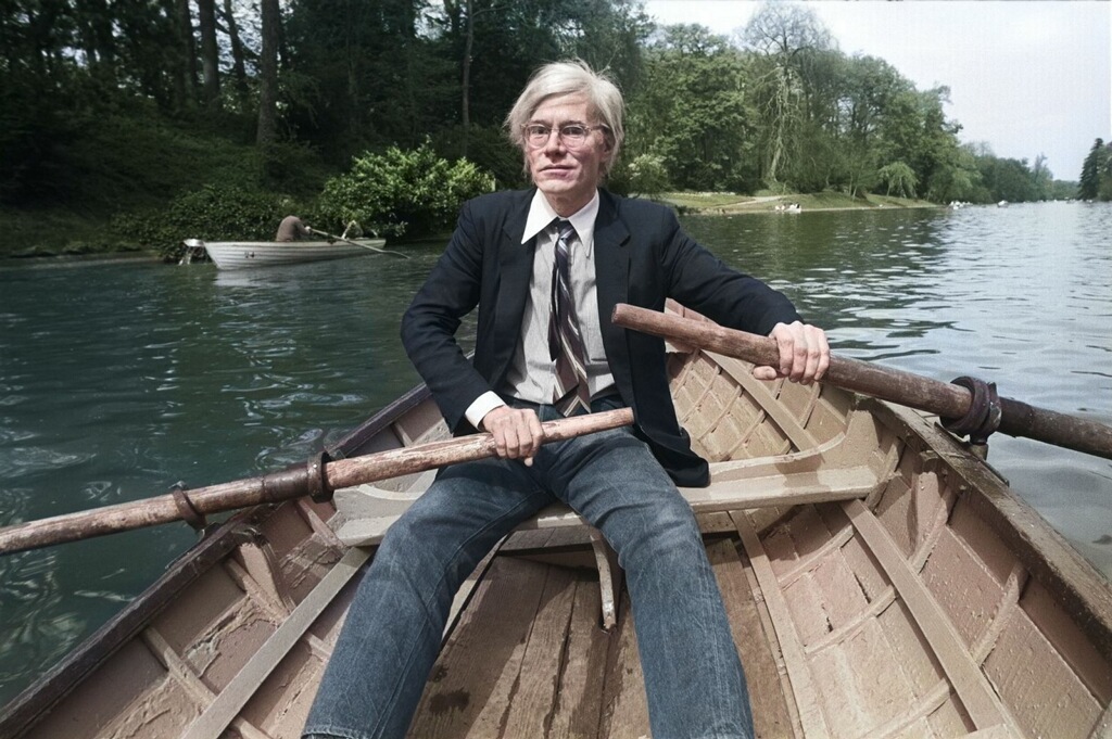 Andy Warhol rowing on a lake at the Bois de Boulogne, Paris. 1981. Photo by Christopher Makos.