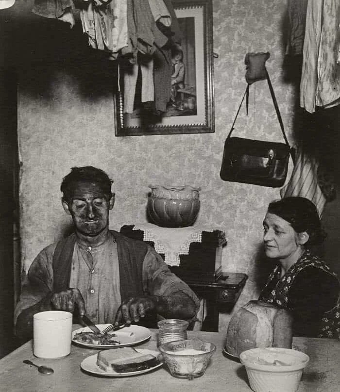 Idiotswithstuff's tweet photo. A miner at his evening meal, 1937 https://t.co/cZnaiv35KY