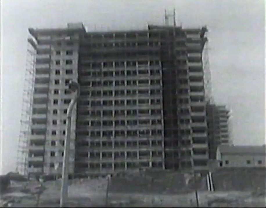 Corriepedia's tweet photo. Here's an interesting shoot from 1963 where Lucille Hewitt watches some flats being built. We thought it might be Walter Greenwood, Eddie Colman and John Lester Courts in Pendleton but there are only two towers. Any experts on Salford history about? #CorrieFilming #Salford https://t.co/Hi7X332ACa