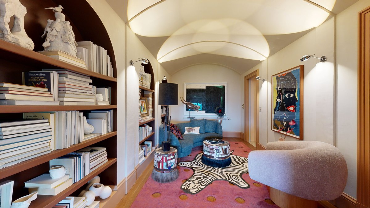 Matterport's tweet photo. Literary treasures line the walls of this cozy and eclectic space like prized trophies, a perfect living space for the modern-day collector. Sara Balloon calls in inspiration from #PeggyGuggenheim to transform this #sfshowcase room into an #art atelier: https://t.co/upzYT4XEVk https://t.co/Bu8cSN2aL1