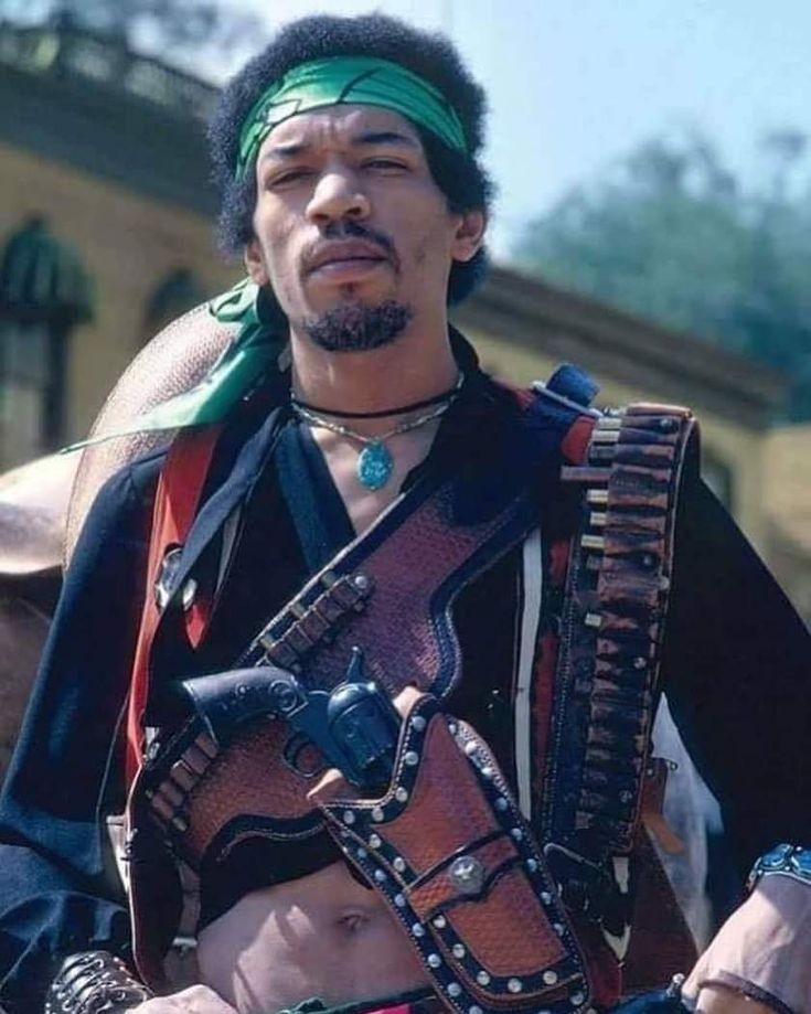 Paul Gulacy used the likeness of rock legend, Jimi Hendrix for the design of his and Don McGregor's cult-classic hero, Sabre. The 1969 photo of Hendrix at right, at The Santa Clara County Fairgrounds was clearly the inspiration.