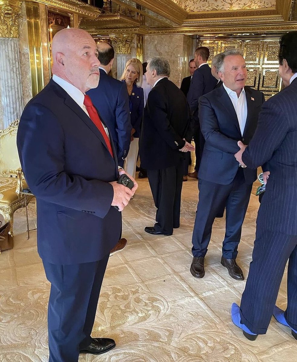 The Entourage assembling in Trump Tower before court this morning. That appears to be former NYC Hells Angels President and meth trafficker Chuck Zito in the sexy blue shoes. All the best people.