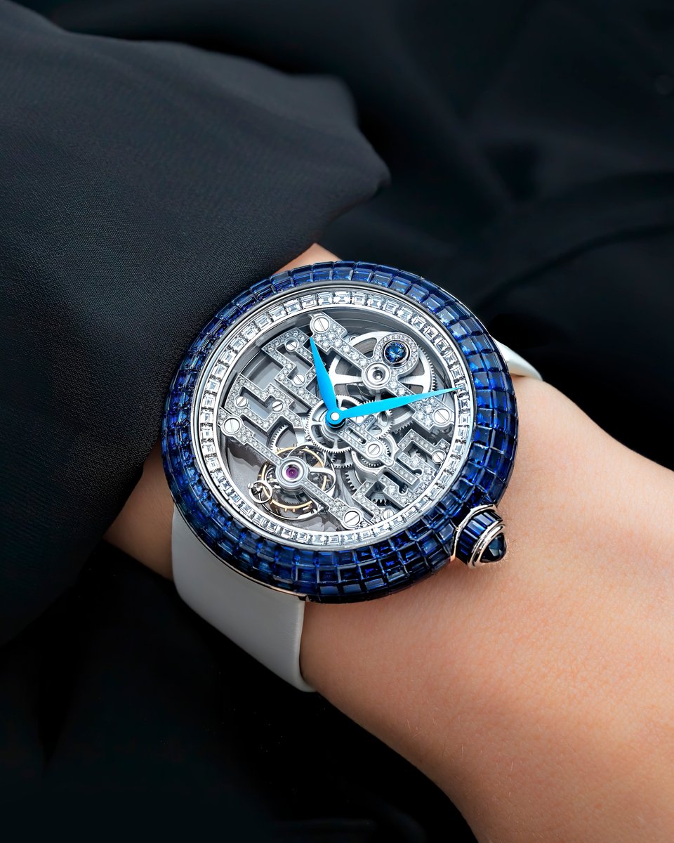 With the Brilliant Art Deco Blue Sapphire, every moment becomes a story of elegance and innovation.
The 18K White Gold case, shimmering with 205 Baguette Blue Sapphires, captures the light and turns it into a dance of luxury on your wrist.