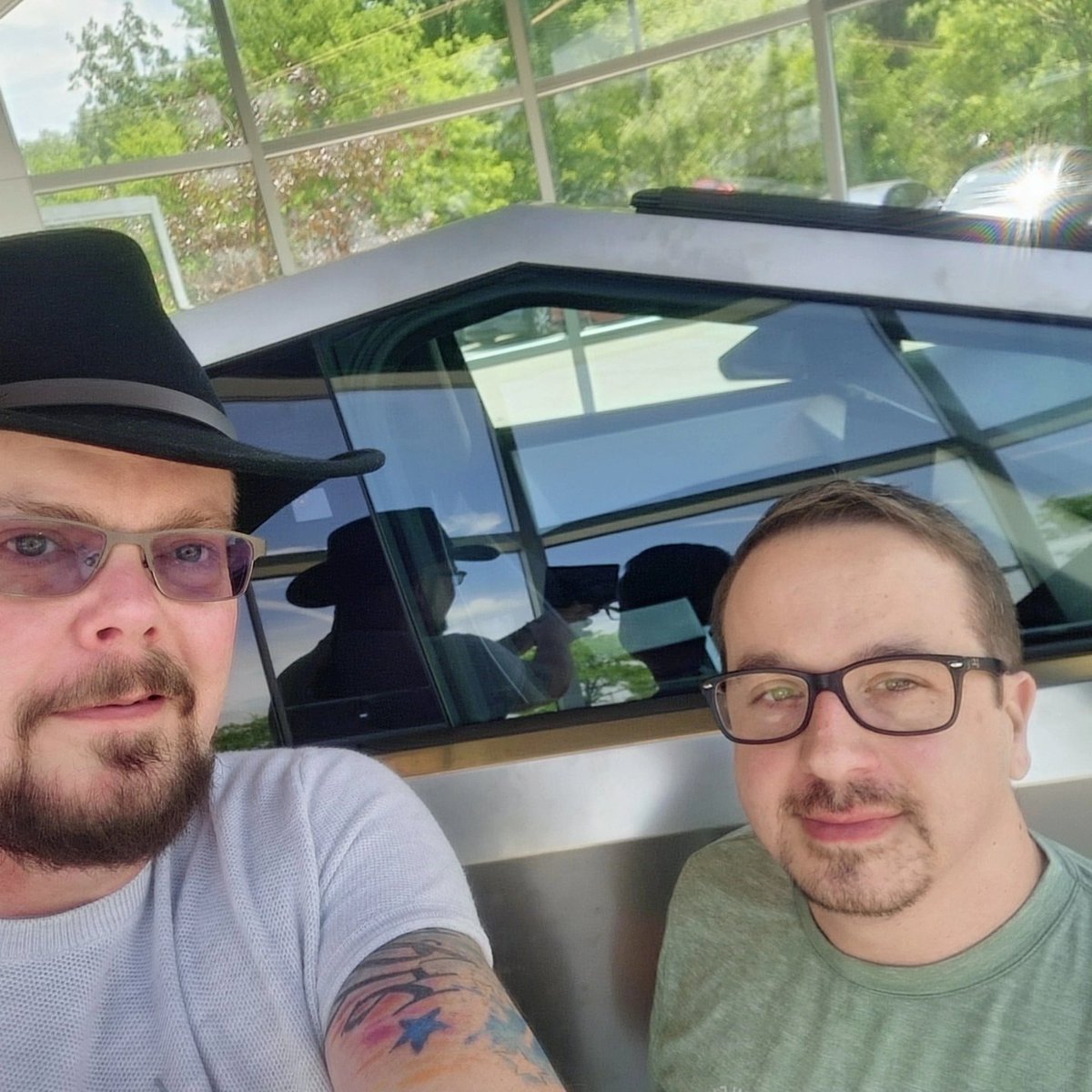 TheRealTJGraham's tweet photo. @navy_4040 and me experiencing a geekgasm checking out the @Tesla #Cybertruck ! Congratulations, @elonmusk and #teslateam, we can not wait to own one!! https://t.co/e46n5t3GeD