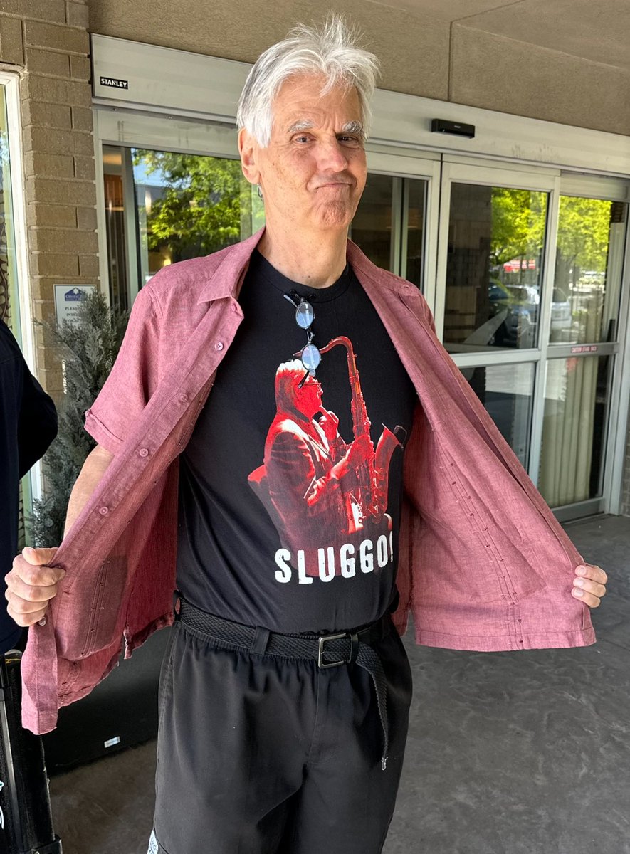 Available Now! The legendary SLUGGO 🎷 his and her tee collection,  SLUGGO from Oingo Boingo Form Members.

limited edition online exclusive for the SLUGGO in all of us 😎

proceeds support JDFR finding a cure for juvenile type one diabetes 
👉🏻 visionmerch.com/sluggo/