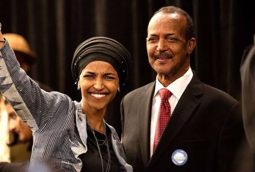 PHOTO: Ilhan Omar with the exiled general for Siad Barre’s Somalian regime, best known for committed the Isaaq genocide (over 200,000 dead). His name was Nur Omar Mohamed. But she preferred to call him “Dad.”
