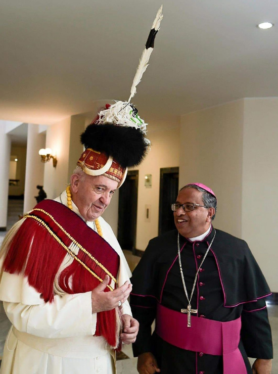 Francis wears a Naga tribal headgear. 

On May 28, 2019, Nagaland Bishop James Thoppil presented a Naga tribal headgear to Pope Bergoglio.

He has patience, love and respect for all demonic and wayward people, but not traditionalists.

Will he ever don a mushroom cap for us