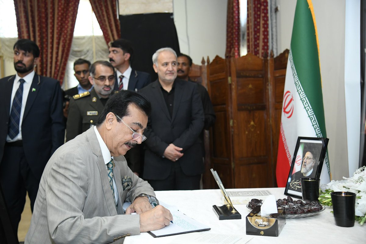 Acting President Syed Yousuf Raza Gillani penned down condolatory remarks over the sad demise of the President of Iran Dr Seyyed Ebrahim Raisi, in the visitor's book, during his visit to the Embassy of Iran