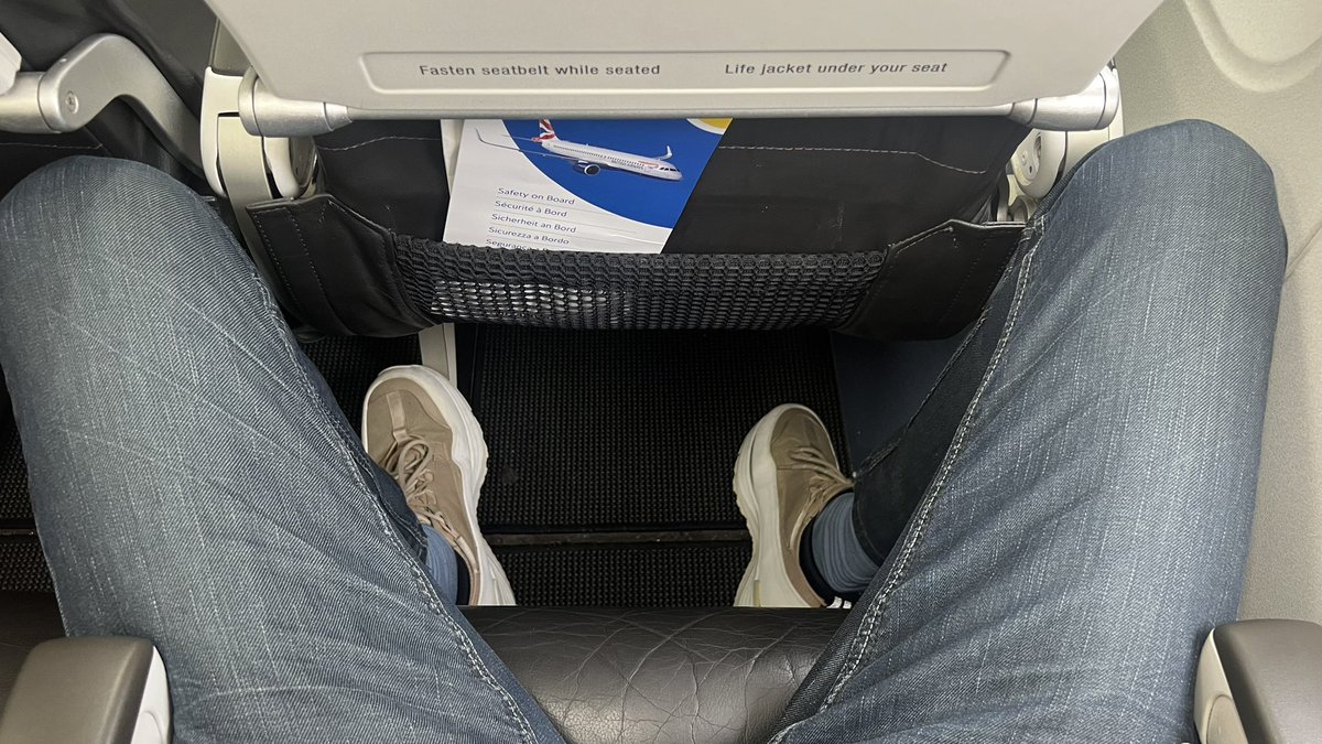 Who decides the seat spacing on airlines? I swear they must all be 150cm short. This is @britishairways flight #ba2590 to Verona. It is not possible to sit in this seat if you are taller than 180cm. When did airfares stop including an actual seat space in the price?