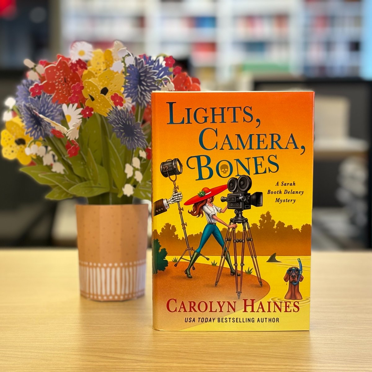Happy #pubday to the wonderful <a href="/DeltaGalCarolyn/">Carolyn Haines</a>, whose sleuth Sarah Booth Delaney investigates a producer who vanishes from a film shoot, &amp; a foot floating in the Mississippi! Get a copy of LIGHTS, CAMERA, BONES to find out what happens--or you can wait for the movie version--
