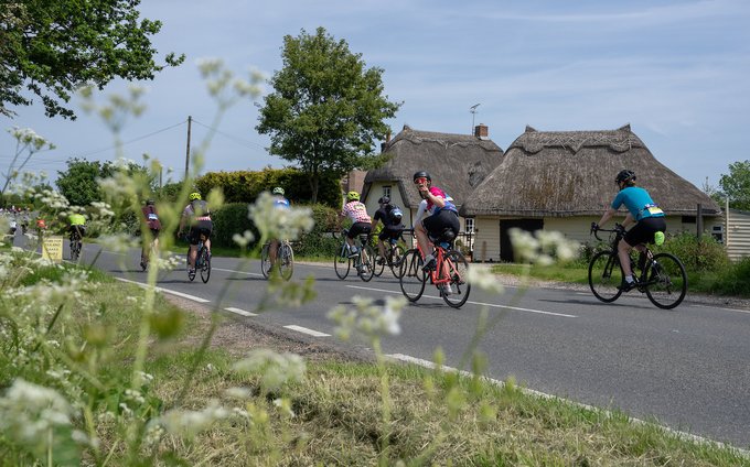 Riders taking part in the Ford RideLondon-Essex 100 pass through the countryside near Dunmow during Ford RideLondon on Sunday 28th May 2023.