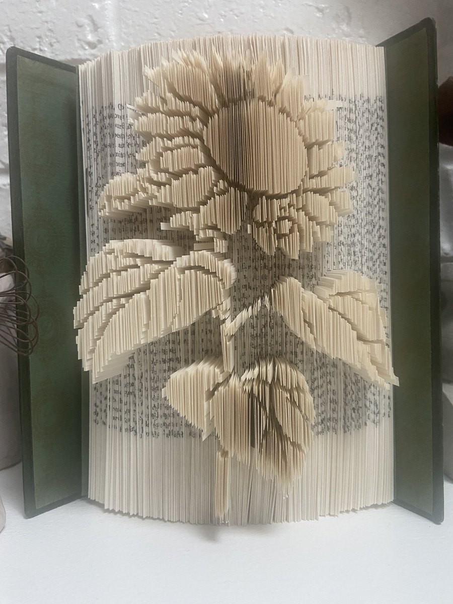 As some of you know, I am obsessed with sunflowers. My daughter bought me this beautiful gift- a book with a sunflower carved out of the pages. She got it on Etsy. Obsessed!