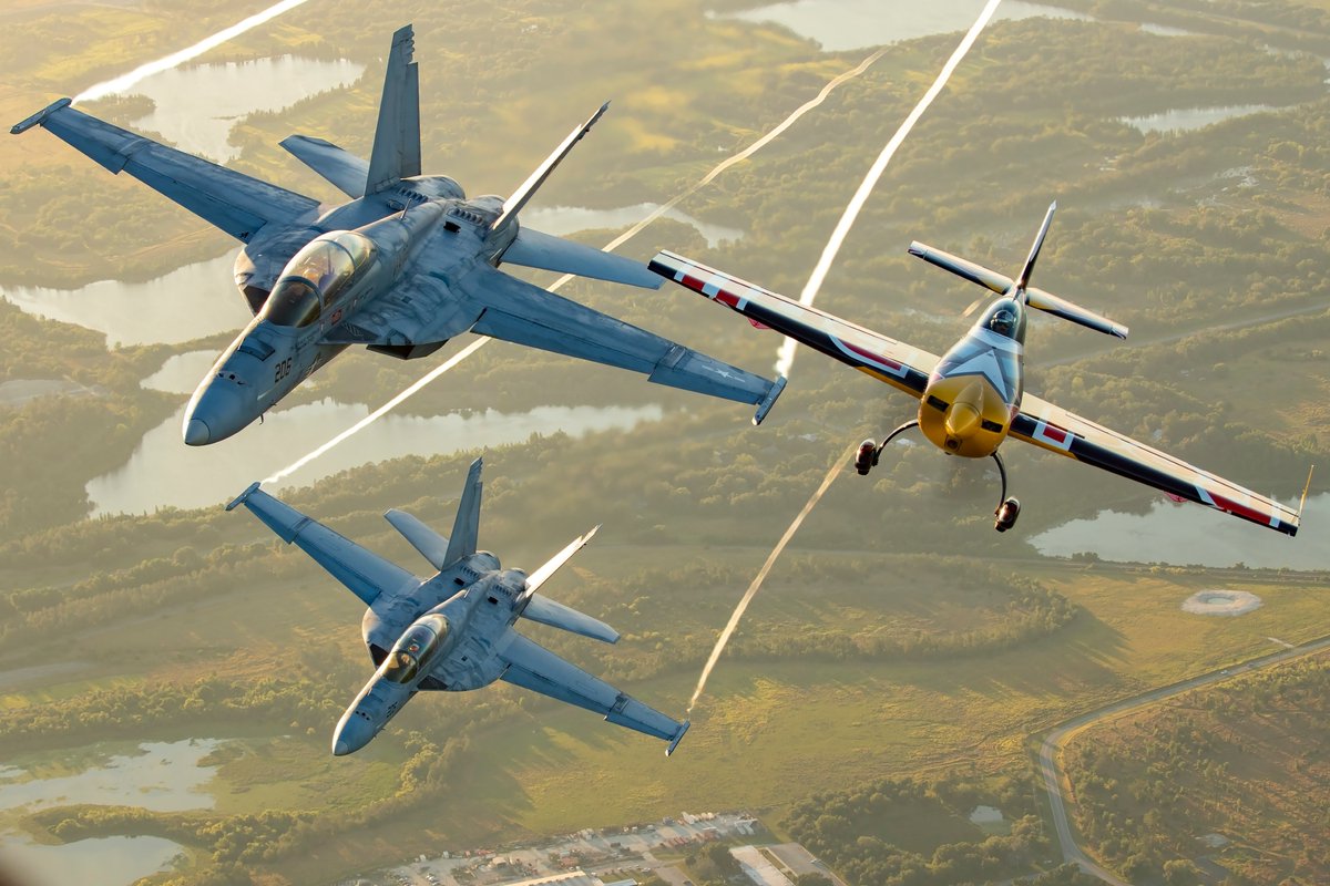 What do you think of these incredible air-to-air shots from Aviation PhotoCrew during #SNF24 of Rob Holland and Kevin Coleman in formation with the F-18 Rhino Demo Team?? #SUNnFUN #SNF50th #Aviation #Airshow #F18 @rhinodemoteam @thekevincoleman @robholland5150