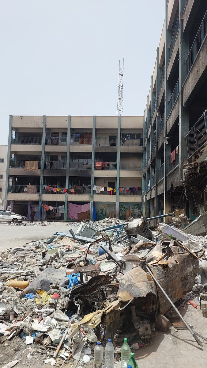 After evacuation orders from #Rafah, the population in @UNRWA facilities in Khan Younis alone has increased by 36%. Photos taken yesterday show families living among rubble in damaged schools, lacking tents, essential services & vital supplies. No place is safe in the #GazaStrip