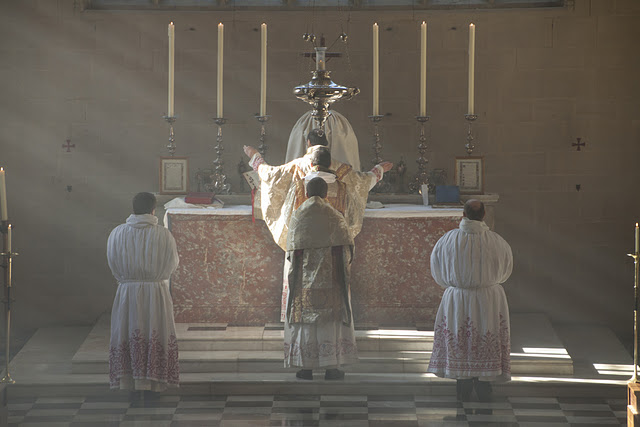 The orans position symbolizes Christ's hands stretched on the cross, which is especially visible in the Dominican rite. It's not at all appropriate for the laity.