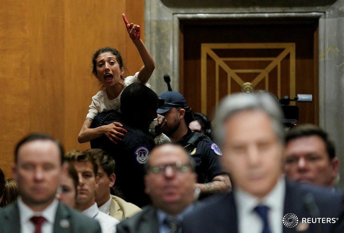 A pro-Palestinian protester being carried off by police shouts at U.S. Secretary of State Antony Blinken as he testifies before a Senate Foreign Relations Committee hearing, on Capitol Hill in Washington, U.S., May 21, 2024. REUTERS/Kevin Lamarque