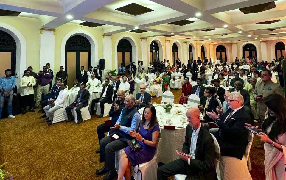 Gurudev's tweet photo. An event to commemorate 200 years of the arrival of tea-garden workers from Tamil Nadu was celebrated in #SriLanka. 

A postal stamp was released on this occasion in the presence of the Hon’ble Governor of the Eastern Province - Mr. Senthil Thondaman and the Hon’ble Speaker of Sri Lankan Parliament - Mr. Abeywardena. 

The event was also attended by the NSA - Mr. Ratnayaka, Foreign Minister - Mr. Ali Sabry and several ambassadors from various countries.