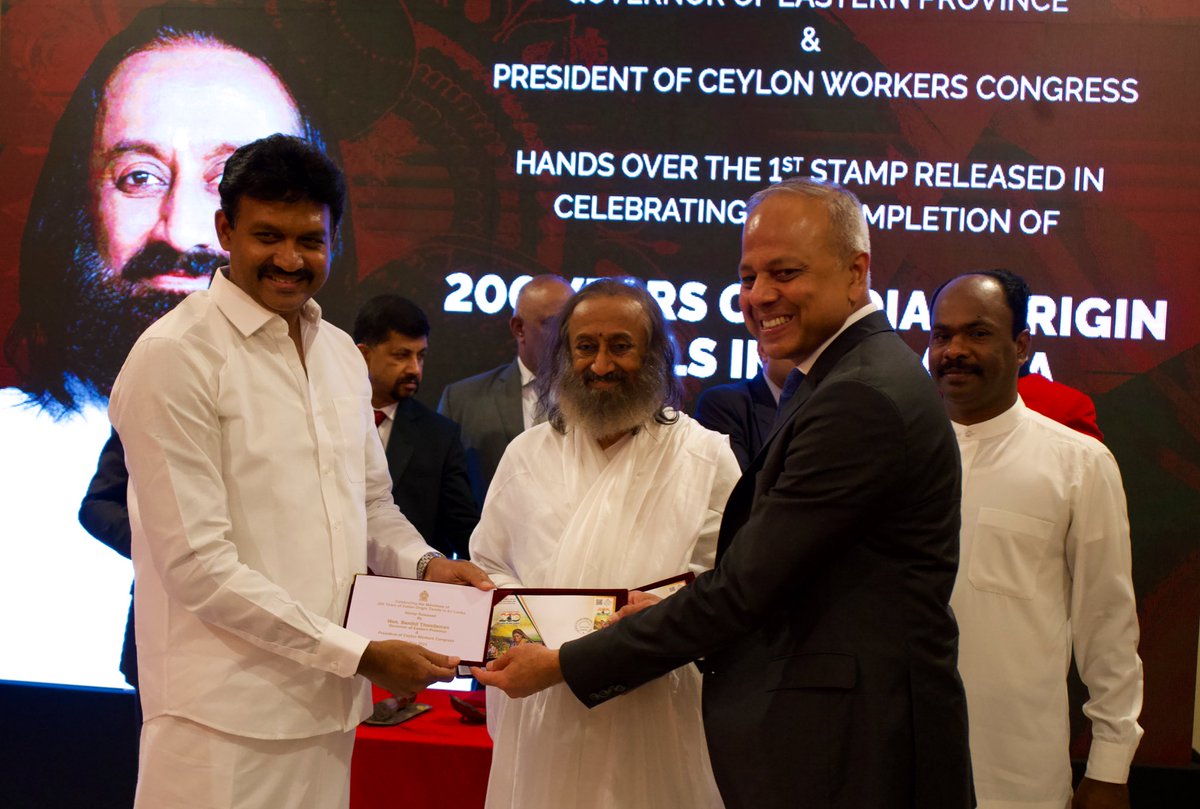 Gurudev's tweet photo. An event to commemorate 200 years of the arrival of tea-garden workers from Tamil Nadu was celebrated in #SriLanka. 

A postal stamp was released on this occasion in the presence of the Hon’ble Governor of the Eastern Province - Mr. Senthil Thondaman and the Hon’ble Speaker of Sri Lankan Parliament - Mr. Abeywardena. 

The event was also attended by the NSA - Mr. Ratnayaka, Foreign Minister - Mr. Ali Sabry and several ambassadors from various countries.