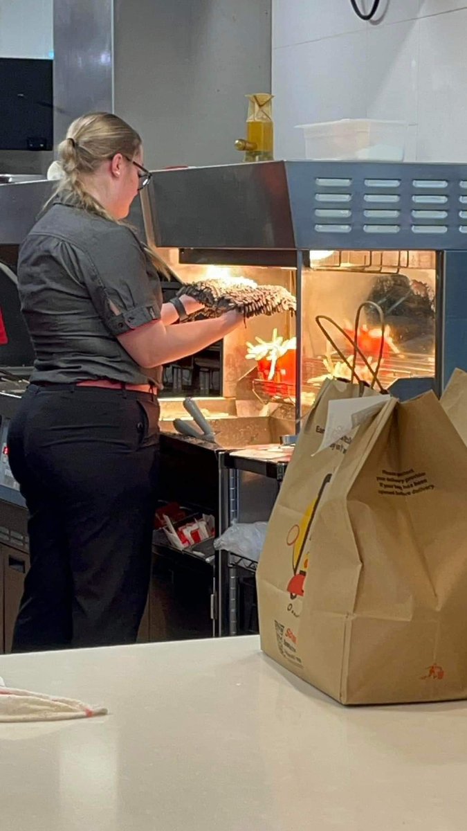 do you want fries with that? McDonald's worker drying her mop heads under a heat lamp 😆🤦