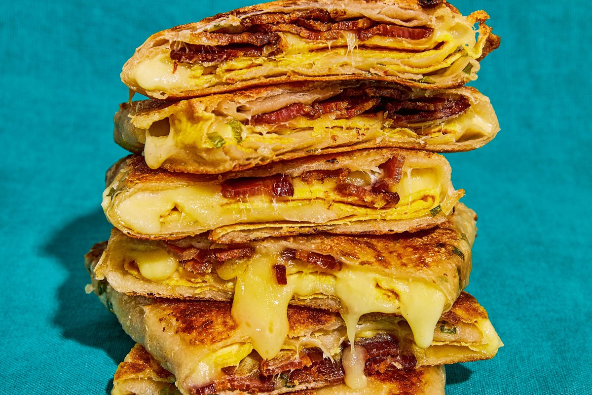 One of the most popular items on the menu at Win Son Bakery in Brooklyn? The ultimate bacon, egg, and cheese, griddled inside a flaky, crispy scallion pancake. @WisconsinCheese #f52partner food52.com/recipes/88853-…