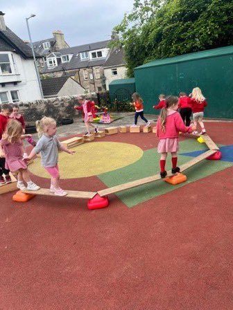 The floor is lava !🔥 To keep our nursery children safe we built a bridge using the loose parts to help us cross over the lava safely. #teamwork