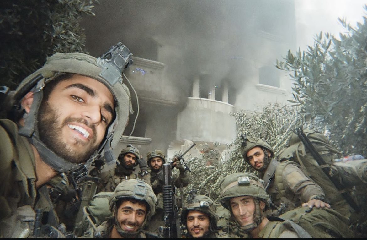 Israeli occupation soldiers pose for images and selfies as they set fire to Palestinian homes in Gaza.