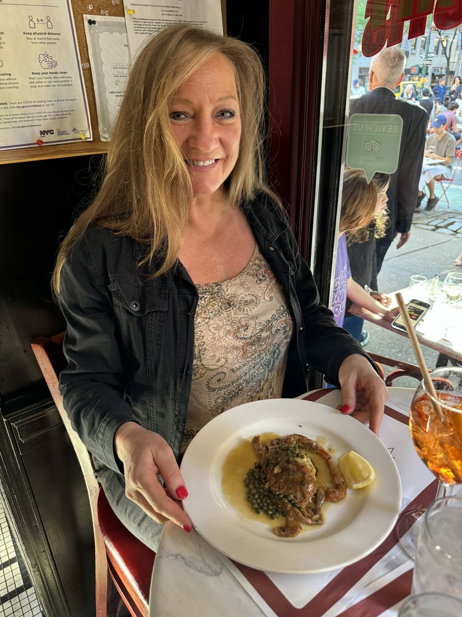 Portrait of our lovely guest Katherine enjoying our @mannysbistrony softshell crab special — yes, they’re still in season! We’re doing them with a delicious lemon-caper sauce. Bon appetit! #mamnysbistro #softshellcrab #softshellcrabs #crabs #seafood #bonappetit #nyc #newyork