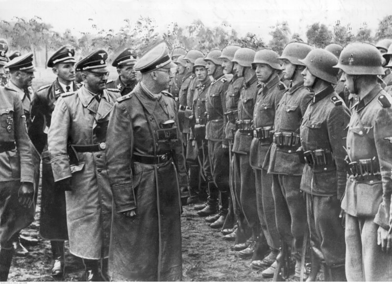 Heinrich Himmler was arrested today on May 21 , 1945 by the British soldiers in Germany . He committed suicide the next day by swallowing a cyanide pill. You can see Himmler visiting the Waffen-SS Ukrainian 14th division at their training camps in 1943