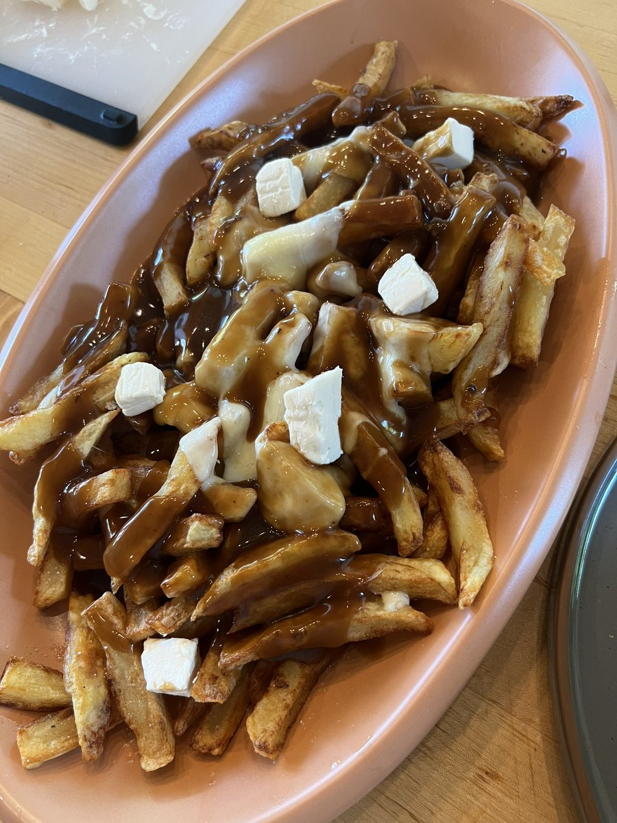 Raclette poutine. #may21familyfoodnight Raclette cheese is under hand it fries