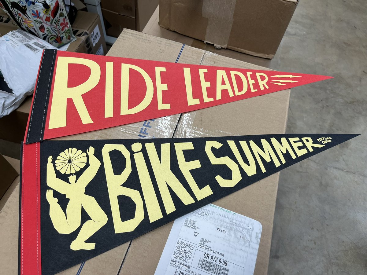 New #BikeSummer pennants hot off the press! See y’all this Thurs for our first ever Merch Pickup Party where, even if you haven’t pre-ordered your merch yet, you can stop by & snag a Ride Leader Pennant, see friends roll in, & try on shirts to see what size you want to order. 😊