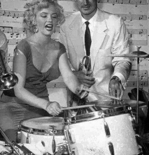 Marilyn Monroe drumming up some excitement at a party hosted by Ray Anthony, 1952