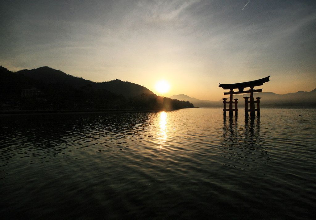 The Floating Torii Gate at Miyajima, Japan buff.ly/4bsYkYv #photography #travel #FloatingTorii #torii #toriiGate #ItsukushimaShrine #Shrine  #Shinto  #island #Itsukushima #Miyajima #Japan #sunset #mountain #sea #harbor #silhouette #nihon #nippon #sun #japanese