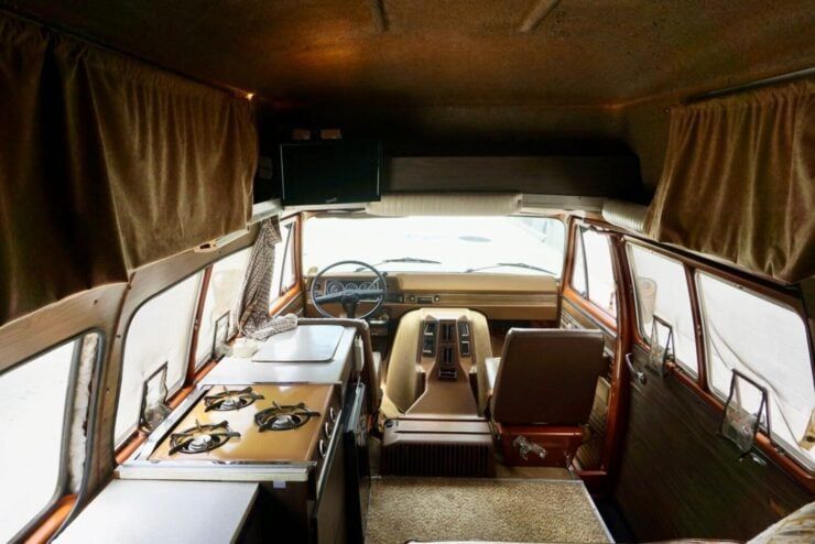 This is a 1973 Chevrolet Van that’s been converted into a high-top camper with a sink, fridge, double bed, drawers, cupboards, curtains, a 110 volt line in, and even an A/C unit. silodrome.com/chevrolet-van-…