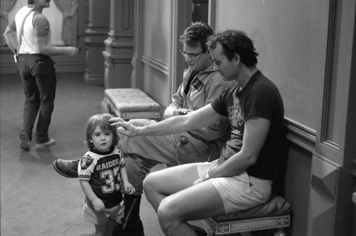 Dan Aykroyd and Bill Murray with Bill's son Homer on the set of Ghostbusters (1984). Photo credit: Gemma Lamana