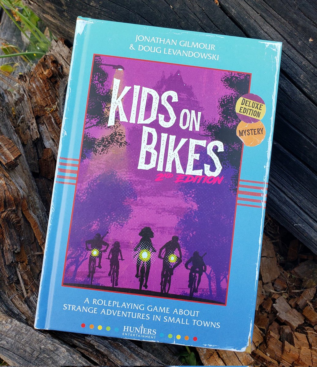 My copy of #KidsonBikes 2nd Edition Deluxe Hardcover from @Hunters_Ent arrived!

It's also the first @Kickstarter that I backed as well. Can't wait to play it!

#kidsonbikes2e #kob2e #huntersentertainment #ttrpg #ttrpgcommunity #tabletoprpg #gamers #kickstarter #mailcall