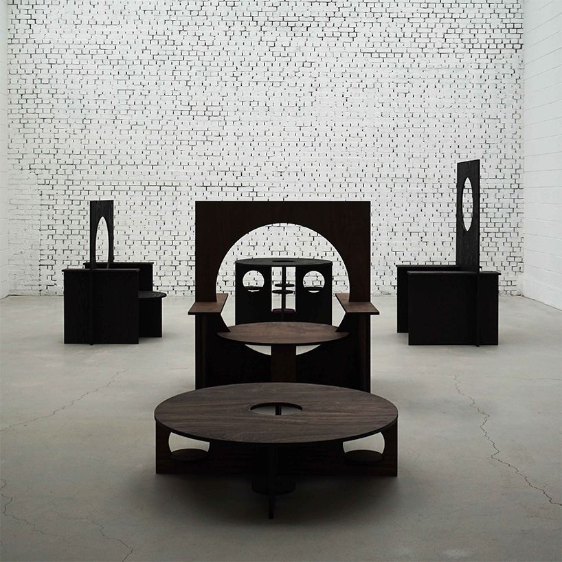 woocheol shin pierces dark wood furniture with circular openings for porthole series buff.ly/4bqSfvH
