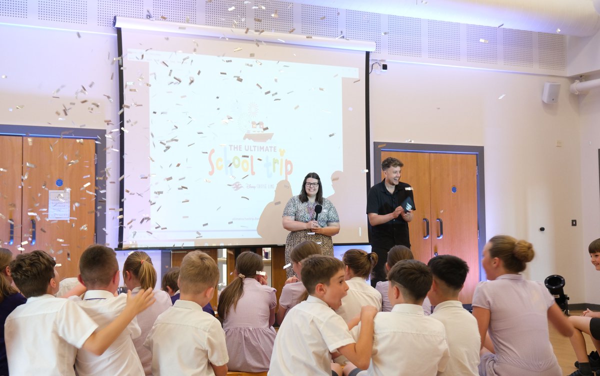 Broadcaster Roman Kemp made a surprise appearance at Goat Lees Primary School in Ashford, Kent, to announce that Miss Emma Chapman's class had won The Ultimate School Trip with @DisneyCruise - a four-night UK sailing on Disney Dream in August.