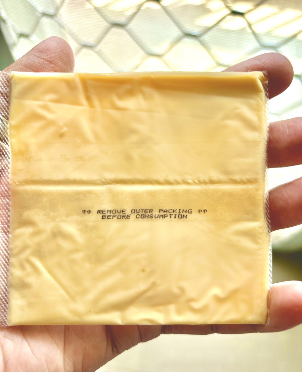 I mean, how clueless can someone be? They literally had to print 'remove outer packaging before consumption' on a cheese slice! Guess some people like their cheese *extra* crunchy? 🧀🙄