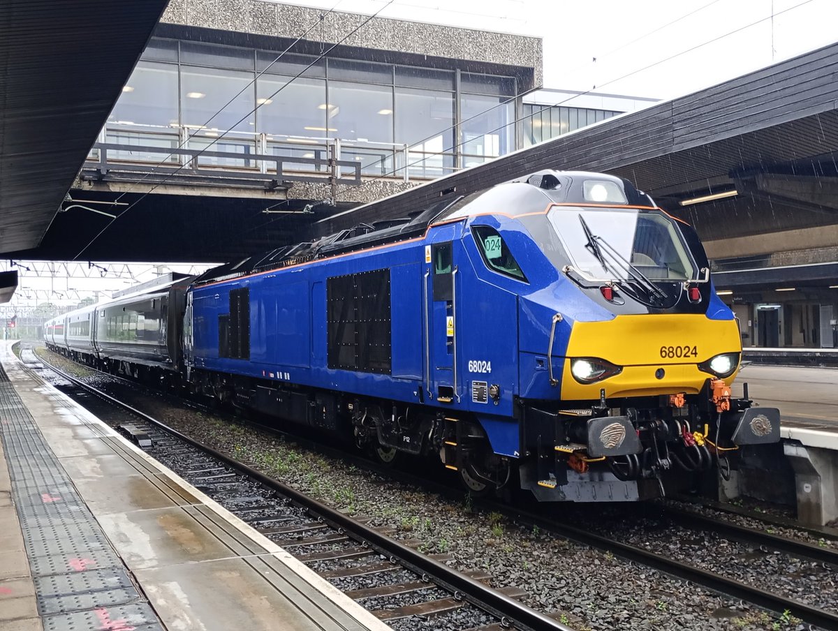 68024 with a set of debranded Mk5s pauses at Stafford while working this morning's 5Q94 Longsight T.M.D to Long Marston.