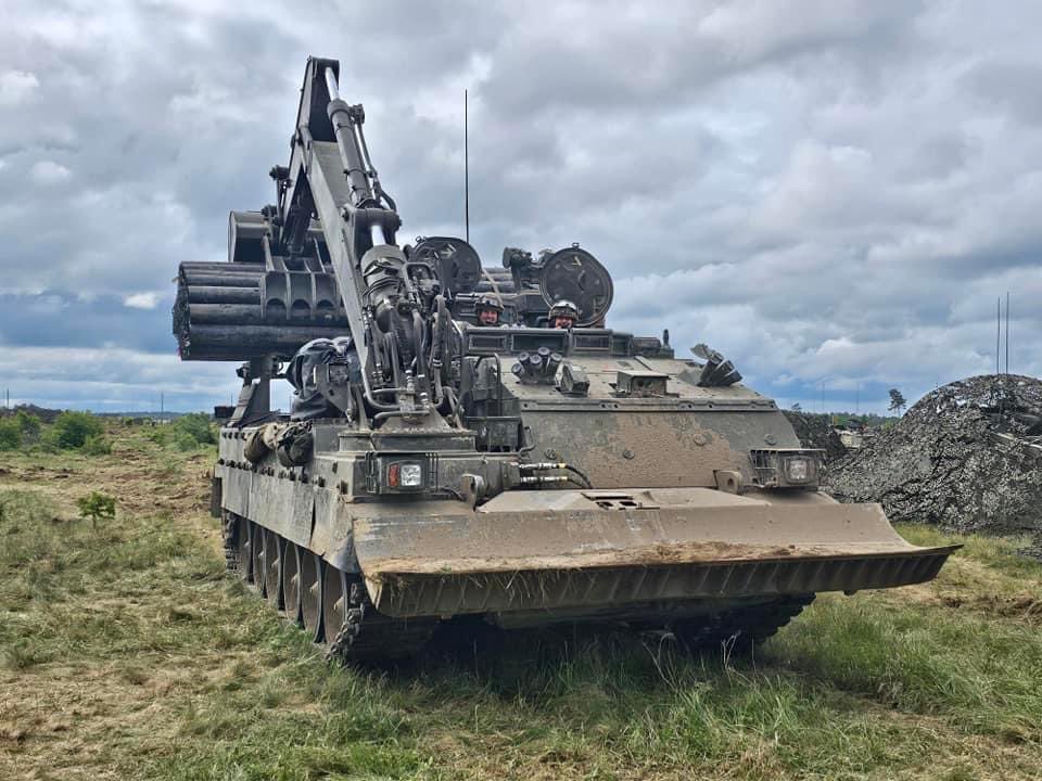 ArmouredSapper's tweet photo. Trojan AVREs operating alongside our NATO allies during a recent exercise in Poland. 

The Trojan AVRE is the @3rdUKDivision’s primary breaching vehicle for complex armoured obstacles and minefields. 

Armoured Sappers enable the Warfighting Division to Live, Move and Fight. 🦾 https://t.co/RvPSItVPcT
