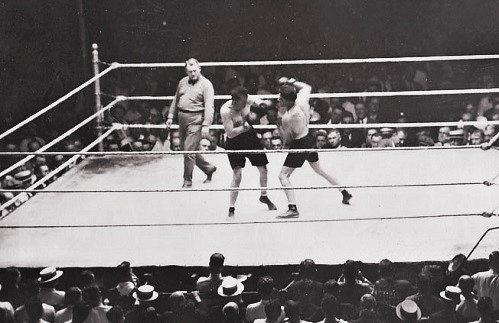 Gene Tunney fires a big right hand at Tommy Gibbons at the Polo Grounds in 1925. Some 40 000 fans saw Gene win by 12th round KO over the same man who went 15 rounds with champ Jack Dempsey. Now Tunney vs Dempsey was the must-see match-up. #Heavyweight #History #Boxing