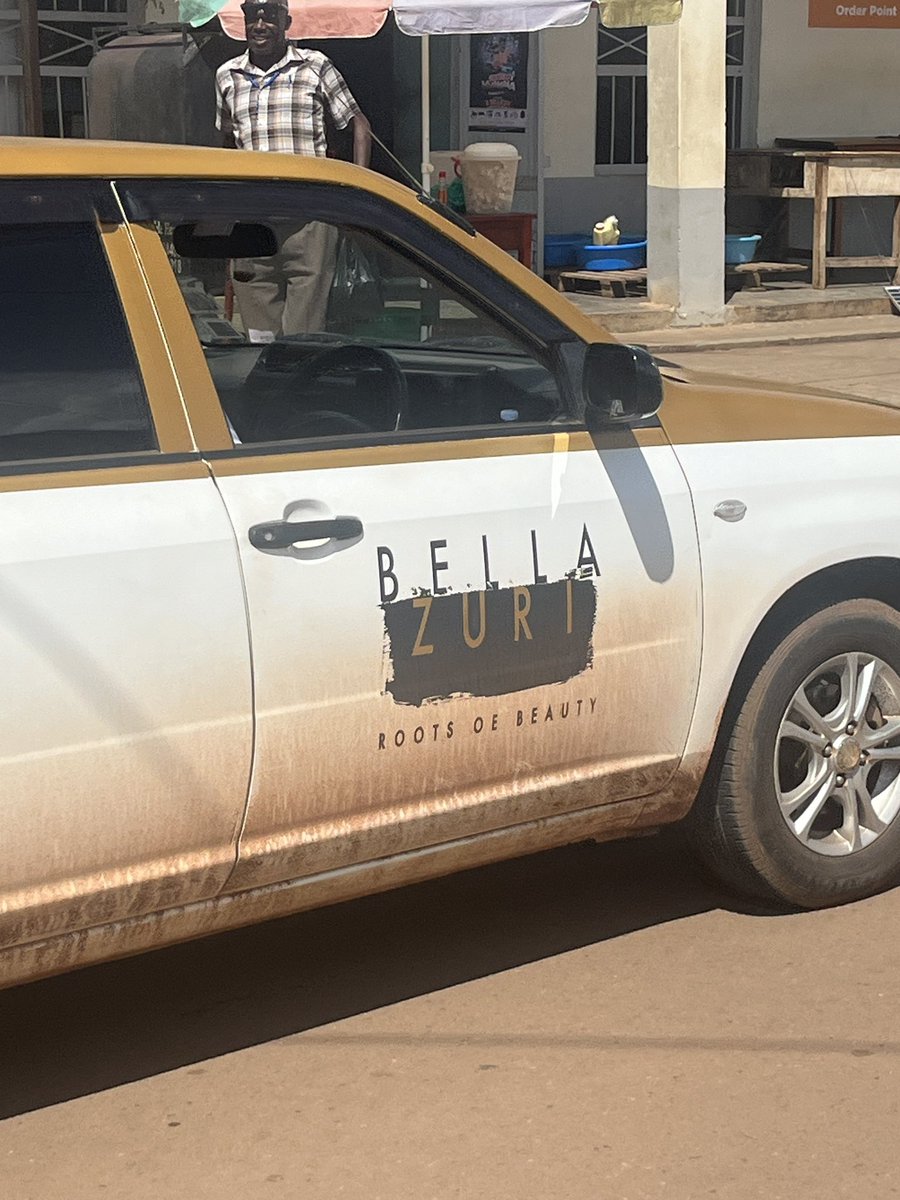 A branded car violating the one way street in Gulu is pushed to reverse to the end of the street. And the arrogance of the drive!