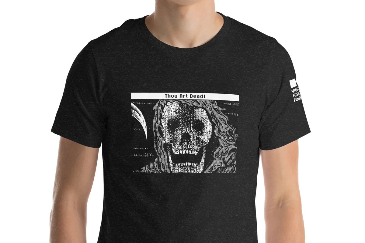 Just in time for World Goth Day: our officially licensed 'Thou Art Dead!' shirt, sporting the classic game over screen from Shadowgate (in the original spooky Macintosh black and white, of course). All proceeds benefit historical video game preservation! …game-history-foundation.myshopify.com/collections/fe…