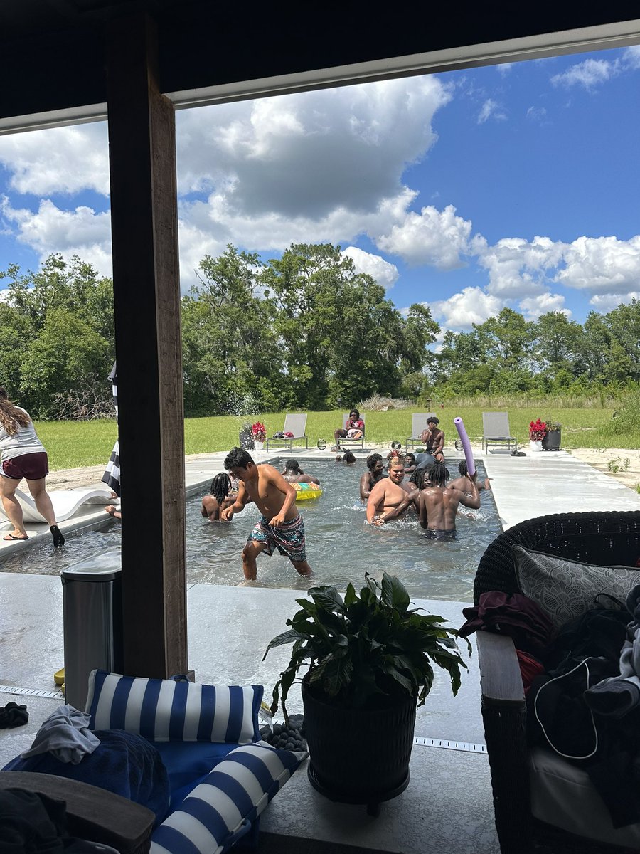 MadCoFball's tweet photo. Yesterday the Cowboys was able to lay back and relax a little bit at Coach Harris’s house after school! The fellas enjoyed  some swimming, PS5 gaming and burgers and lots and lots of laughs and fellowship! 
Thank you Ashley Harris for helping to prepare food for all these kids ! https://t.co/Je4o3Rmm9j