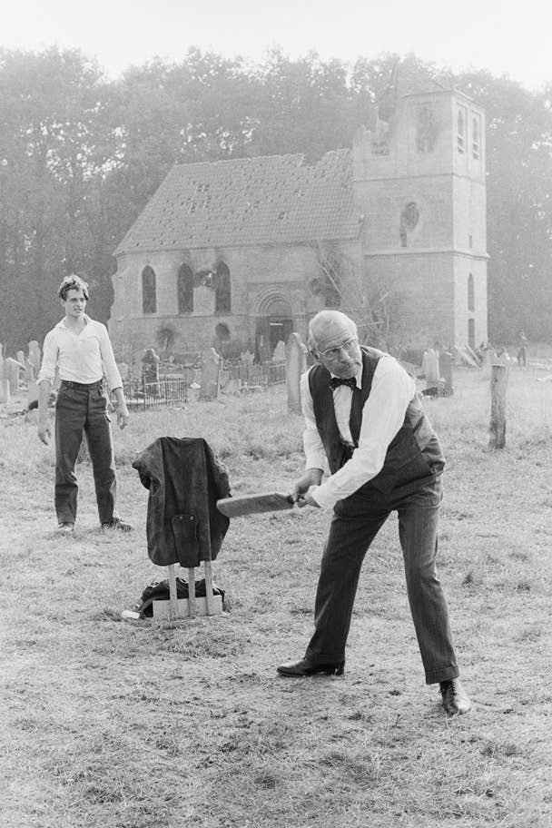Laurence Olivier [born 22nd May 1907] playing cricket in a churchyard in Arnhem, during a break from filming ‘A Bridge Too Far’ [1977] pic by Terry O'Neill